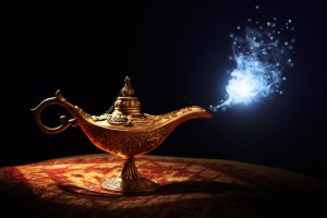Magic lamp from the story of Aladdin with Genie appearing in blue smoke concept for wishing, luck and magic